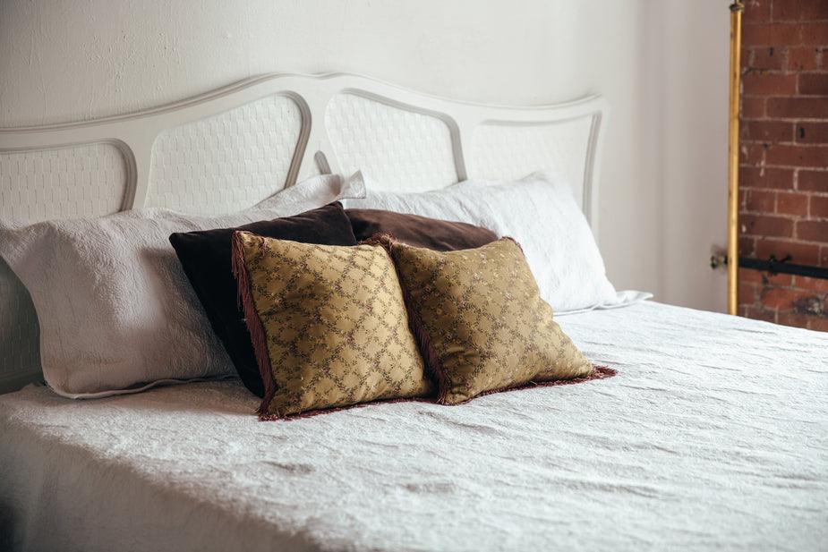 bedroom-bed-with-brown-throw-pillows_925x_9d9d83b0-8a37-4864-8928-969648f6f446 - J.OC